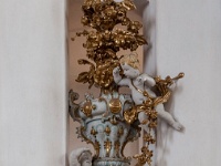 The Wieskirche  A bouquet in gold and white on the piller at the right of the organ gallery